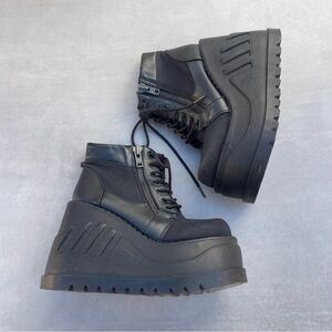 Demonia STOMP-10 Wedge Platform Lace-Up Bootie in Black Canvas